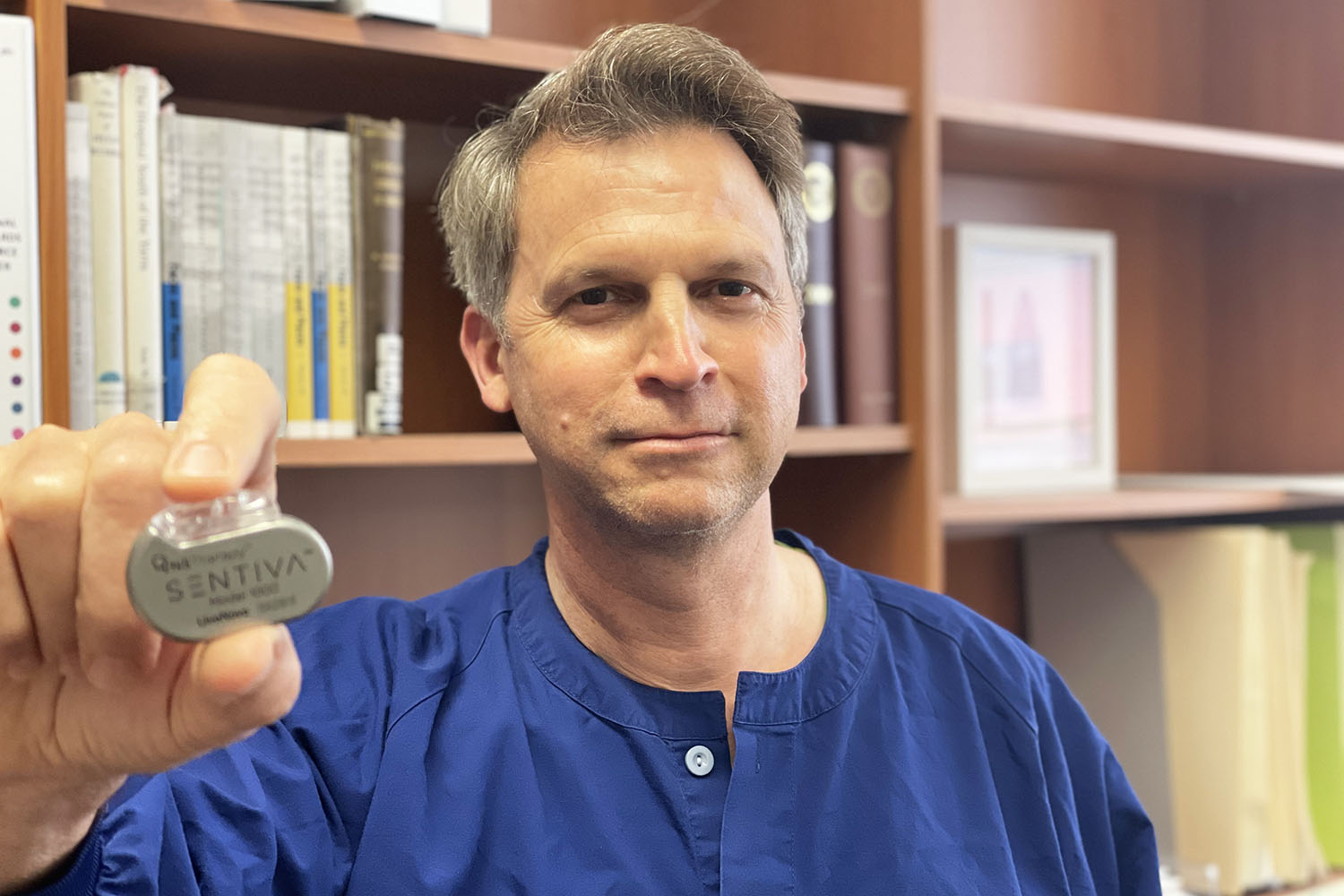 A/Prof Martin Hunn with the SenTiva device