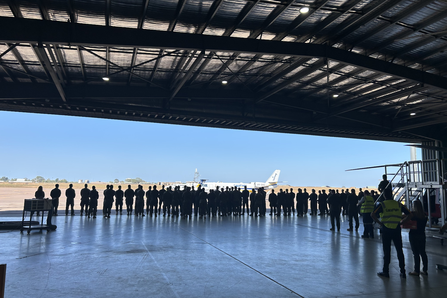 Marines wave goodbye to Travis as his retrieval flight heads to Melbourne. Image supplied by CareFlight.