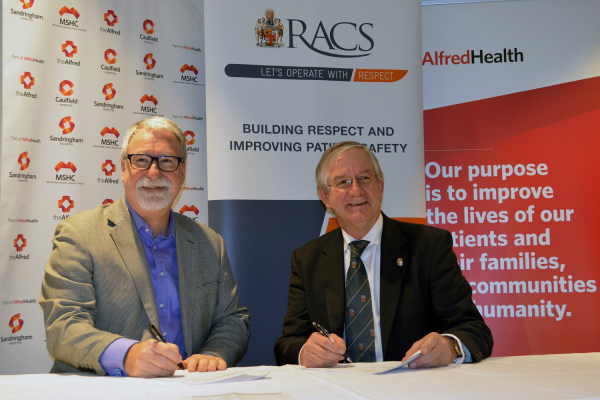 Alfred Health Chief Executive Prof Andrew Way and RACS President John Batten sign MoU to build respectful culture and improve patient safety in surgery