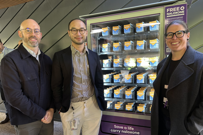 3 Bayside health staff standing in front of now Naloxone vending machine at The Alfred