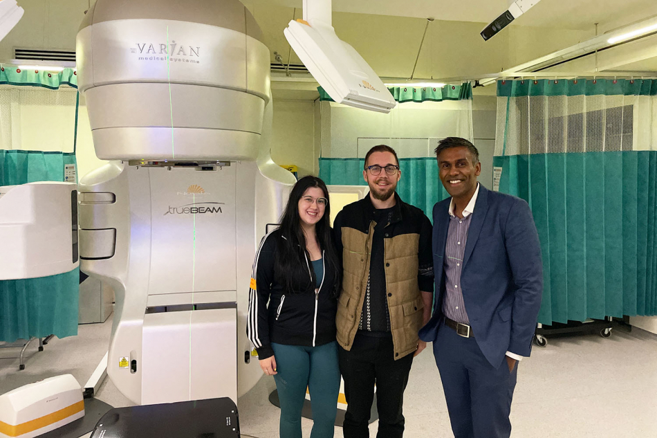 Gabby(Matt's wife), Matt and A/Prof Senthi in the radiation therapy room