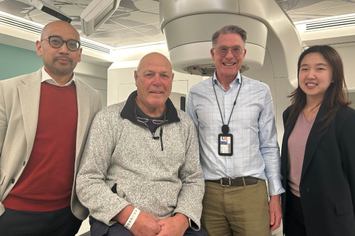 Trial participant John with the radiation oncology team.