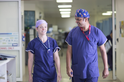 Staff in scrubs walking