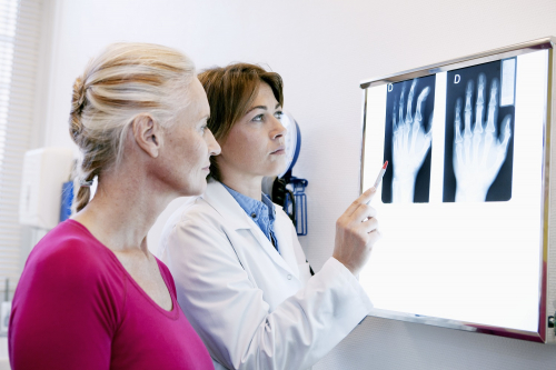 Female patient and Rheumatologist looking at an XRay