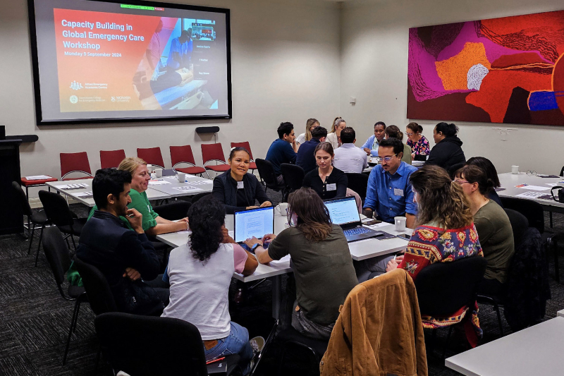 Conference participants sitting in two groups having a discussion